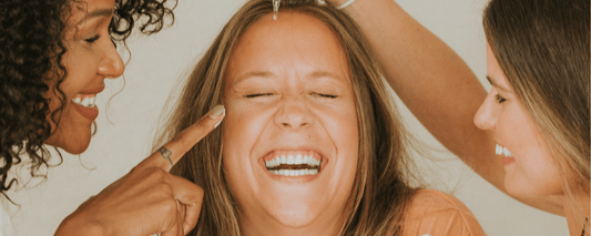 Happy women applying cream with the sandwich method for retinol for their mother in Why Retinol Might Not Work After Menopause (And What to Try Instead)