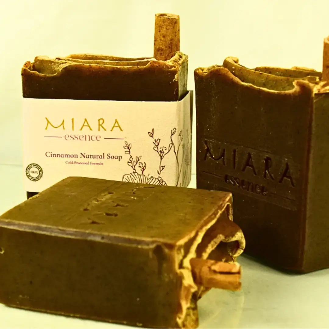 Brown soap bars with 'MIARA Essence Cinnamon Natural Soap branding on a light background