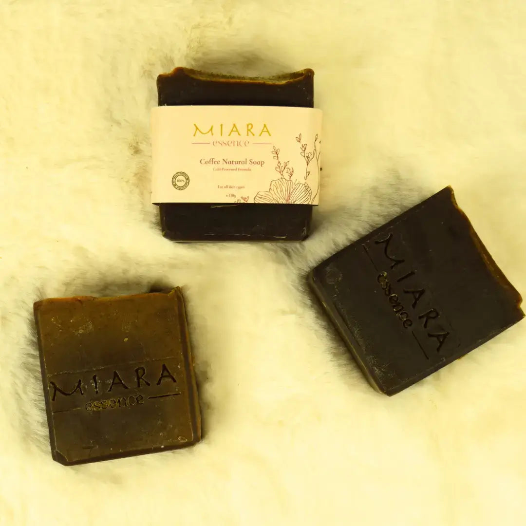 Miara Essence Coffee Natural Soap bars displayed on a soft surface, showcasing natural ingredients and packaging.