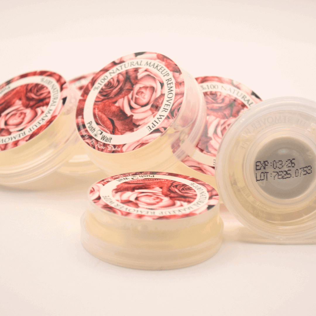 Close-up of natural makeup remover wipes jars with rose designs, ideal for gentle and effective skin cleansing.