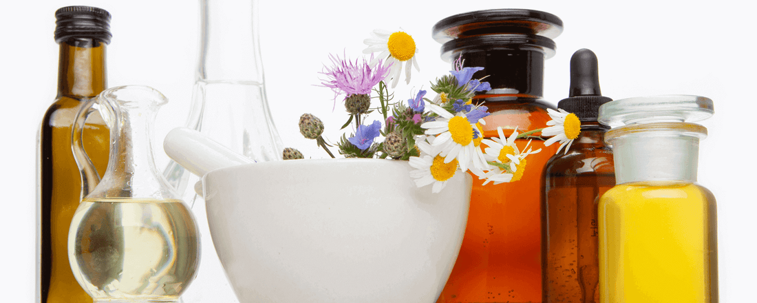 Natural remedies for Skin Issues During Ramadan with herbal oils and a mortar.