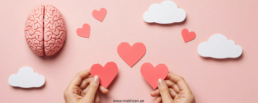 Hands holding hearts with a brain and clouds, symbolizing the mental health and skin connection.