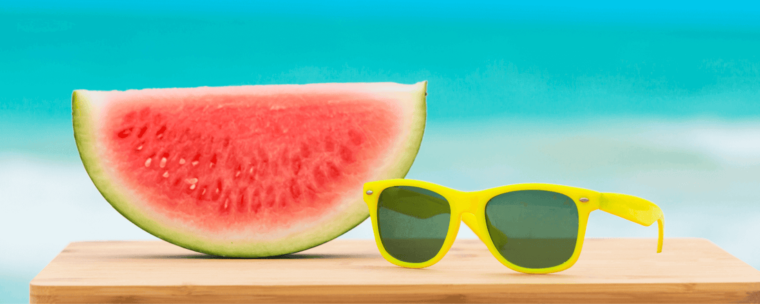 A picture of summer essentials water melon and sunglasses for "10 summer skincare tips for the UAE..."