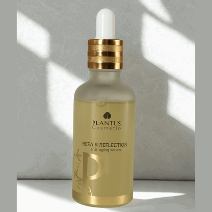 Plantus Cosmetic repair reflection anti aging serum for fine lines bottle with dropper on a light background