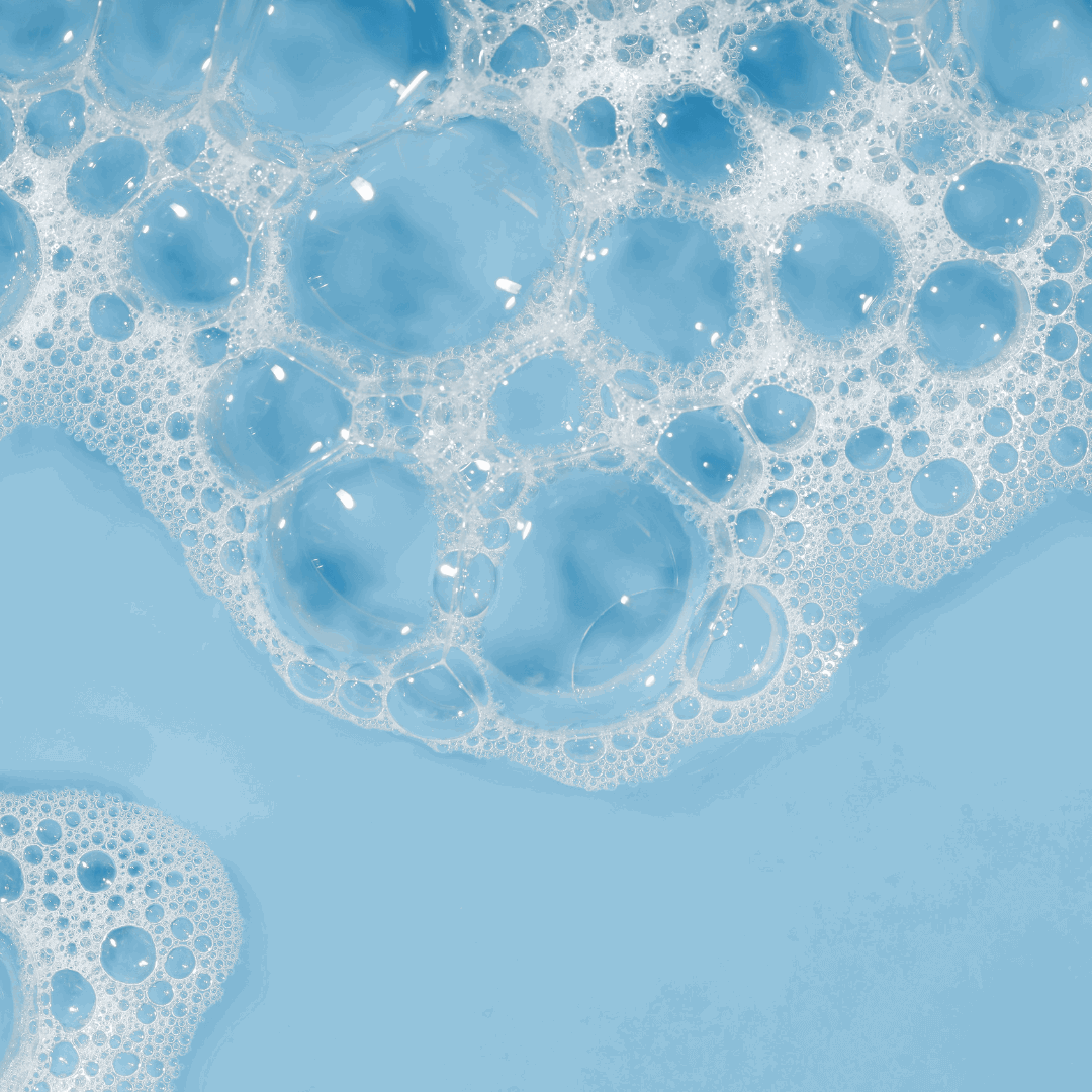 Close-up of blue bubbles from Miara Rice Powder Soap  on a blue background