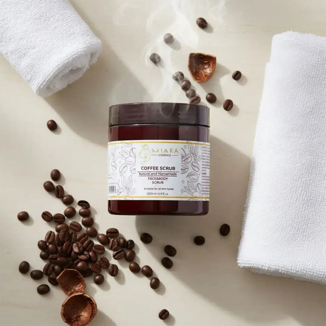 Jar of natural coffee scrub with coffee beans and a towel on a light surface