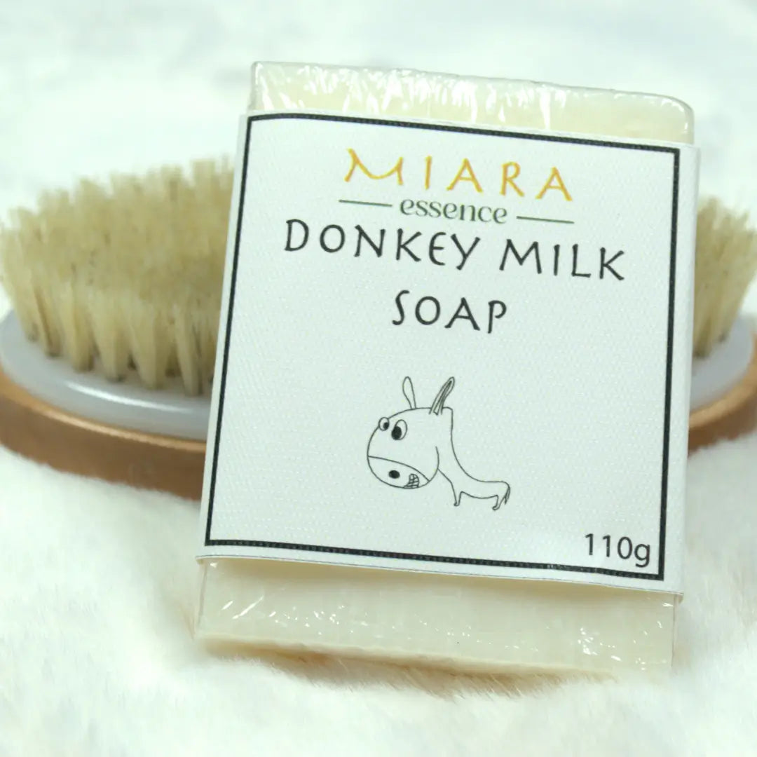 Donkey milk soap with packaging labeled 'MIARA essence DONKEY MILK SOAP' on a white background.