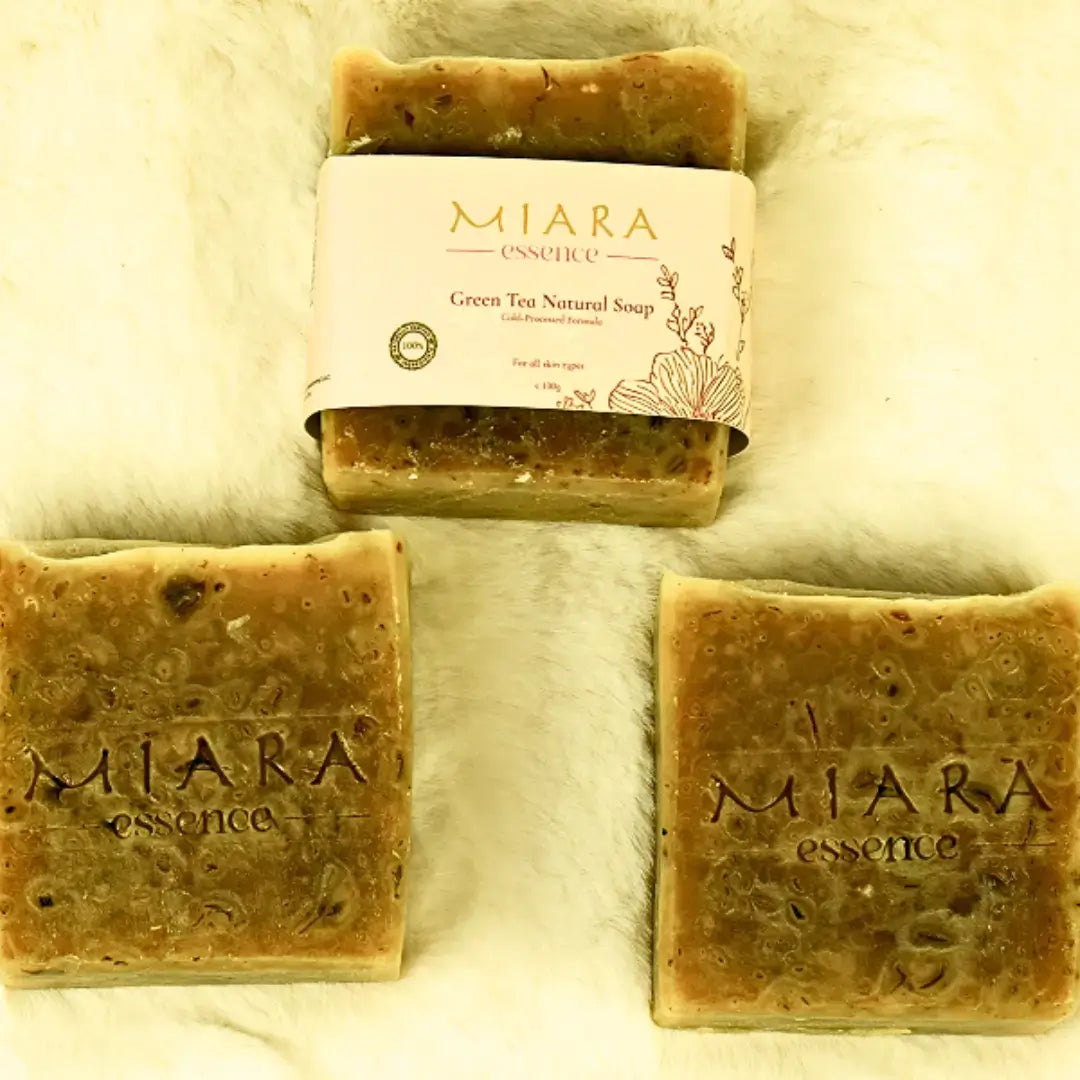 Three bars of MIARA essence Green Tea Natural soap on a textured white background