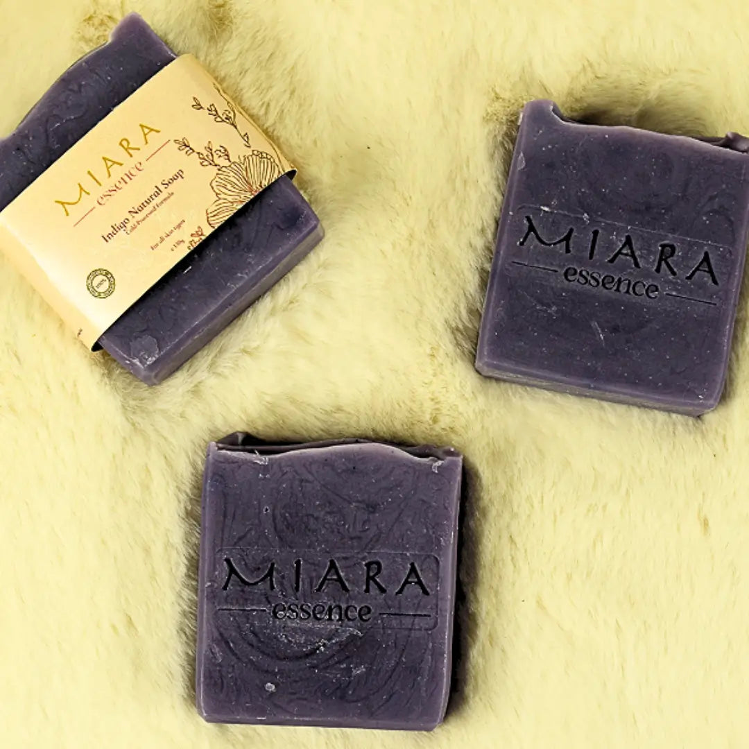 Miara Essence Indigo Natural Soap bars on a light background, showcasing natural ingredients for even-toned skin.