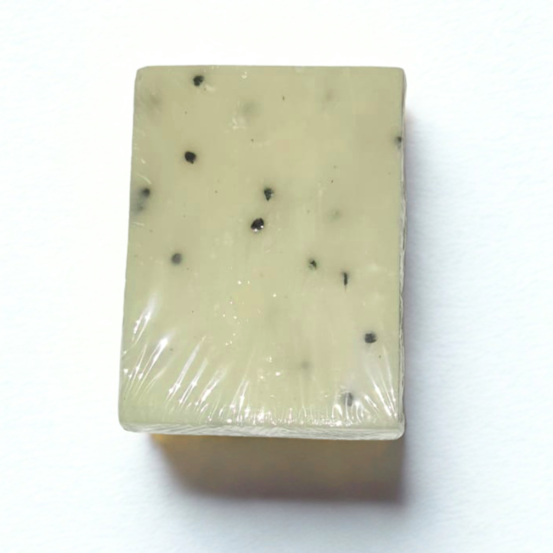 Rectangular bar of soap with black specks Natural Vitamin E Soap |on a white background