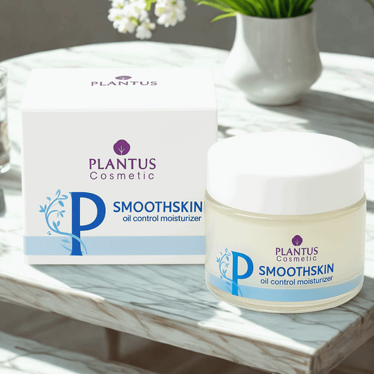 Plantus Smoothskin oil control moisturizer jar and packaging on a marble surface with flowers in the background.